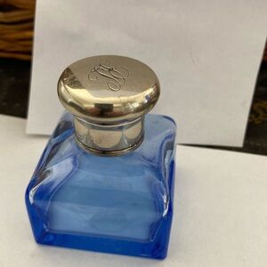 Blue empty perfume bottle